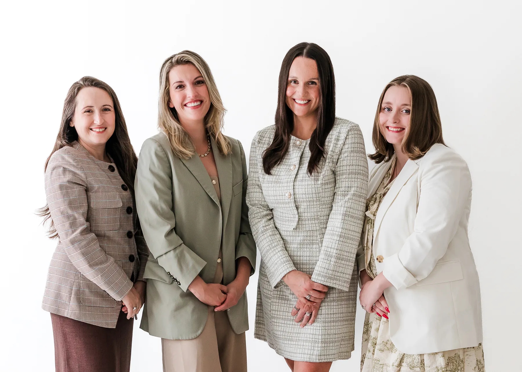 Four Brazil Family Law team members standing together in Winston-Salem, NC